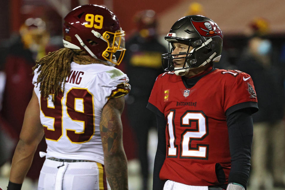 It's all respect between Chase Young and Tom Brady. (Photo by Patrick Smith/Getty Images)