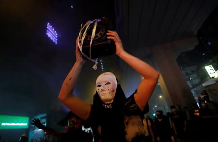 An anti-government protester demonstrates during a rally outside Mong Kok Police Station in Hong Kong