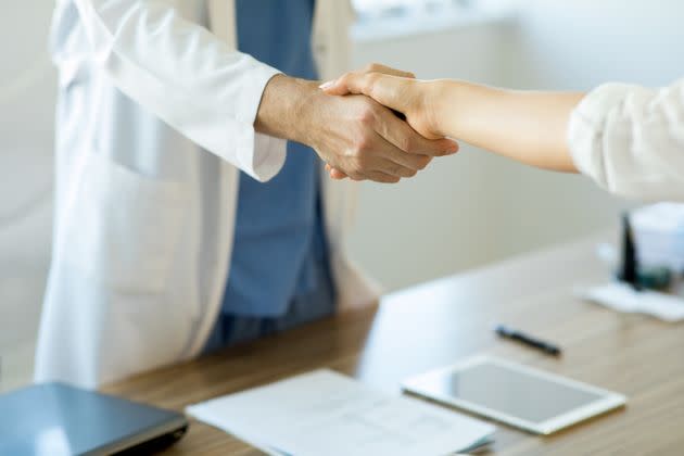 Doctor shaking hands with a patient in consulting room (Photo: bymuratdeniz via Getty Images)