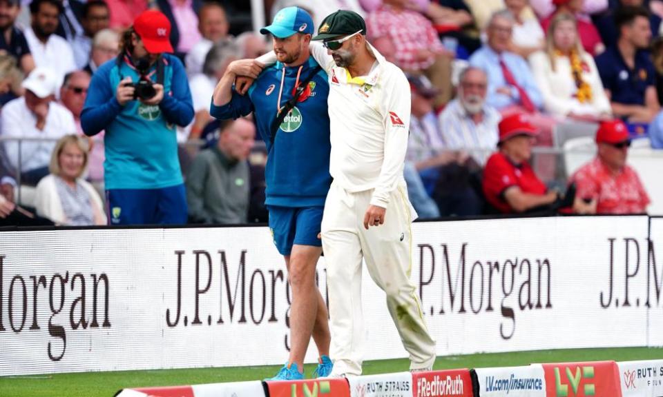 Australia&#x002019;s Nathan Lyon is helped from the field after picking up an injury during day two of the second Ashes Test.