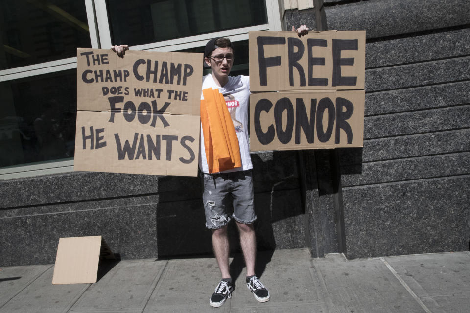 A fan of former UFC champion Conor McGregor shows his support outside Brooklyn Supreme court on June 14, 2018, in New York. (AP Photo/Mary Altaffer)