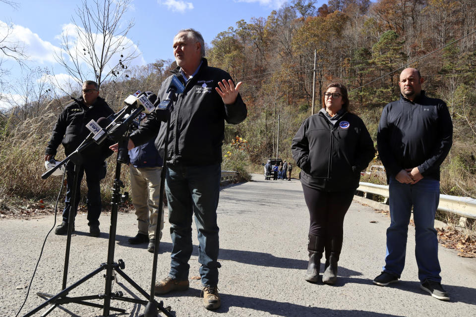 Martin County Judge Executive Lon Lafferty addresses reporters outside a road leading to the abandoned Martin Mine Prep Plant in Inez, K.Y. ,Wednesday, Nov. 1, 2023, where the collapse of an 11-story coal tipple killed at least one man. (AP Photo/Leah Willingham)