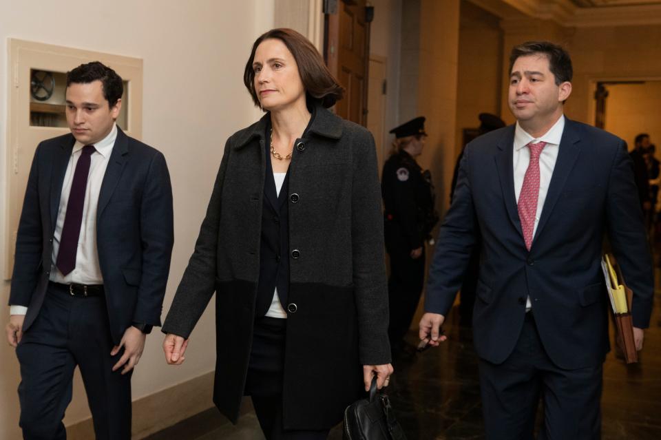Former White House national security aide Fiona Hill, center, arrives to testify before the House Intelligence Committee on Capitol Hill in Washington, Thursday, Nov. 21, 2019.