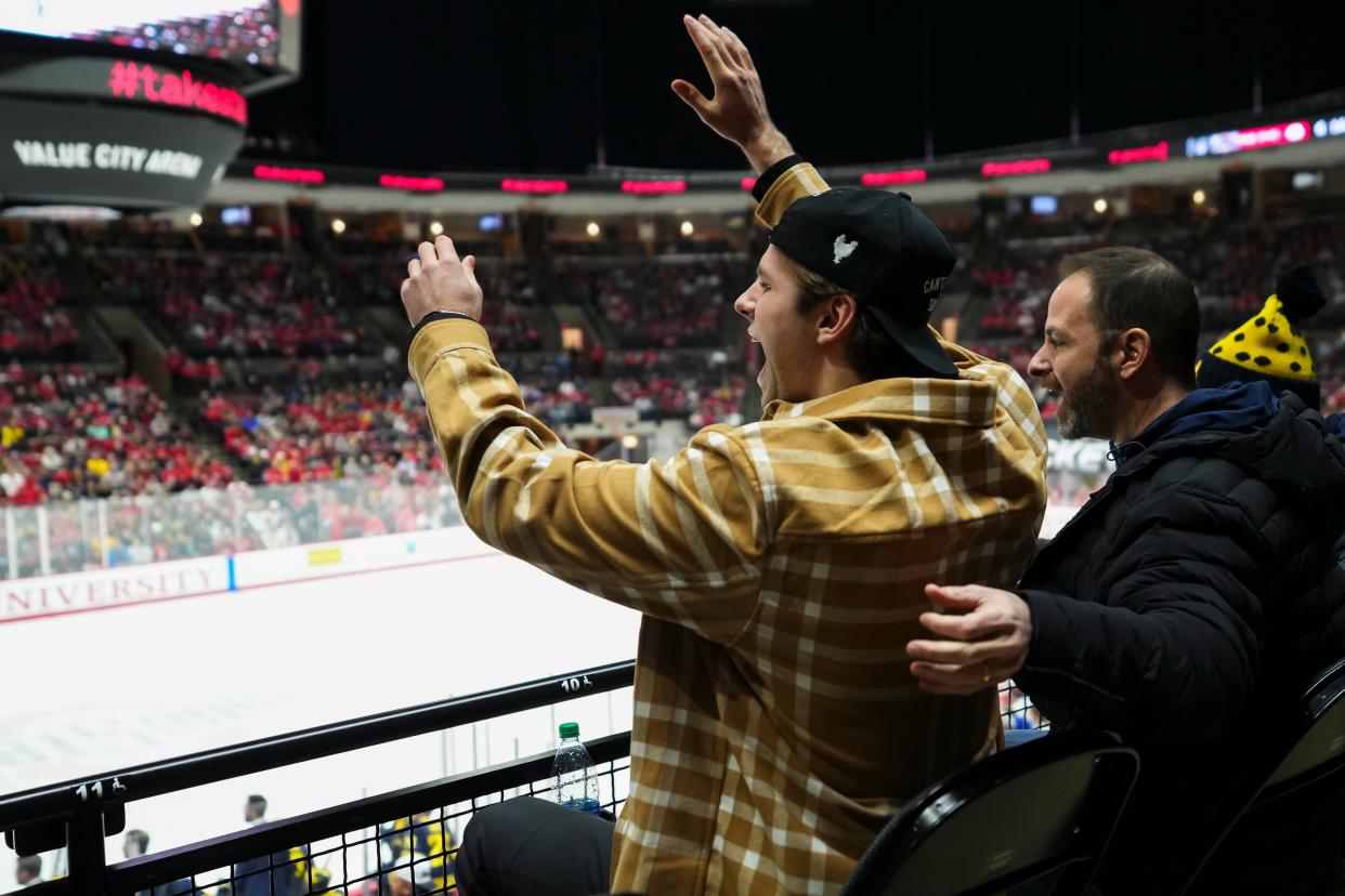 Feb 2, 2024; Columbus, Ohio, USA; Columbus Blue Jackets forward Adam Fantilli cheers on his brother, Michigan defenseman Luca Fantilli and his former Wolverine teammates, during the NCAA men’s hockey game against the Ohio State Buckeyes at Value City Arena.