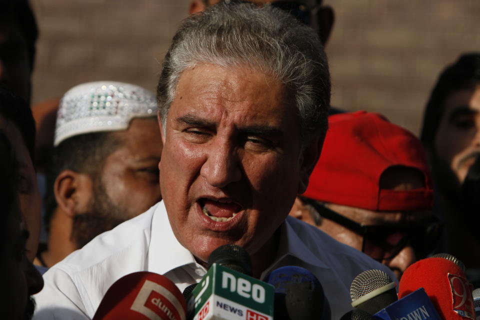 In this Friday Oct. 11, 2019 photo, Pakistan's Foreign Minister Shah Mahmood Qureshi speaks to reporters in Multan, Pakistan. Pakistan got a mixed review for its efforts to curb terrorist financing and money laundering as it tries to avoid being blacklisted by the Financial Action Task Force, a global watchdog, when it meets in Paris Wednesday, Oct. 16, 2019. Qureshi told reporters Friday that the economic affairs minister was already in Paris preparing for the meeting. He accused hostile neighbor India of lobbying to get Pakistan blacklisted. (AP Photo/Asim Tanveer)
