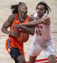 Illinois' Ayo Dosunmu (11) is fouled by Nebraska guard Dalano Banton (45) during the first half of an NCAA college basketball game on Friday, Feb. 12, 2021, in Lincoln, Neb. (Francis Gardler/Lincoln Journal Star via AP)