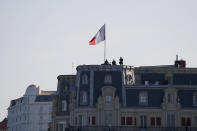 Police forces stand atop a building roof Saturday, Aug. 24, 2019 in Biarritz. Leaders of the Group of Seven countries arrive on Saturday to discuss issues including the struggling global economy and climate change until Monday. They include the United States, Germany, Japan, Britain, France, Canada and Italy. (AP Photo/Francois Mori)