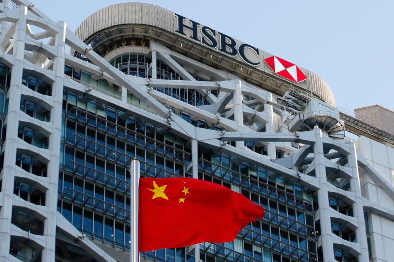 A Chinese national flag flies in front of HSBC headquarters in Hong Kong