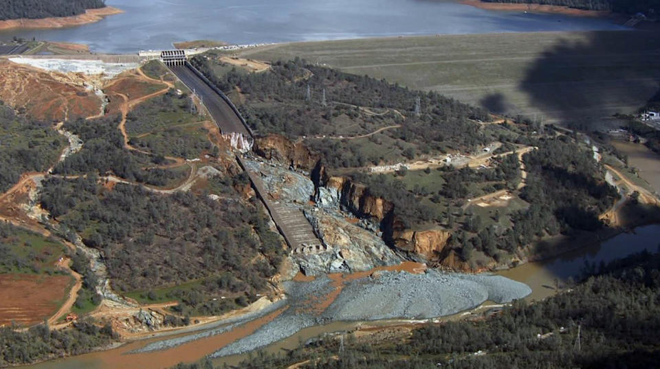 FILE - This Feb. 27, 2017, file image provided by KCRA shows Oroville Dam's crippled spillway in Oroville, Calif. With stormy weather approaching, California plans to resume releasing water down the damaged spillway at the nation's tallest dam.(KCRA via AP, File)