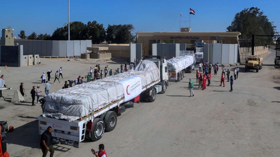 PHOTO: Trucks of Egyptian Red Crecent carrying humanitarian aid for the Gaza Strip cross the Rafah border gate, in Rafah, Egypt, Oct. 21, 2023. (Mohammed Asad/AP)