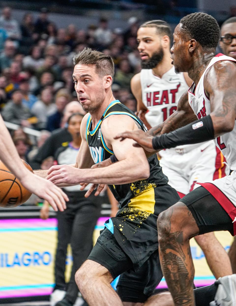 Indiana Pacers guard T.J. McConnell (9) finds a path to the basket during a game against the Miami Heat on Sunday, April 7, 2024, at Gainbridge Fieldhouse in Indianapolis.