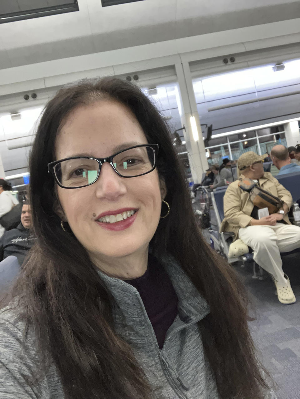 Mabel Junco poses for a selfie at Jacksonville Airport, in Florida, Wednesday, Dec. 13, 2023. Junco, 55, is one of the 125,000 Cubans who arrived in South Florida on a boat in 1980 and got parole. (Mabel Junco via AP)
