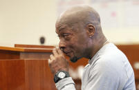 Plaintiff Dewayne Johnson reacts after hearing the verdict in his case against Monsanto at the Superior Court of California in San Francisco on Friday, Aug. 10, 2018. A San Francisco jury on Friday ordered agribusiness giant Monsanto to pay $289 million to the former school groundskeeper dying of cancer, saying the company's popular Roundup weed killer contributed to his disease. (Josh Edelson/Pool Photo via AP)