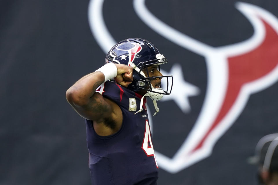 Houston Texans quarterback Deshaun Watson (4) flexes as he celebrates scoring a touchdown against the New England Patriots during the first half of an NFL football game, Sunday, Nov. 22, 2020, in Houston. (AP Photo/David J. Phillip)