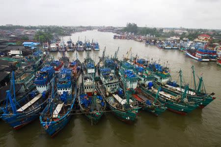 Fishing boats are seen docked at a port as tropical storm Pabuk approaches the southern province of Pattani, Thailand, January 3, 2019. REUTERS/Surapan Boonthanom