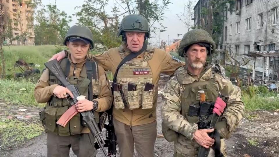 Yevgeny Prigozhin poses with Wagner mercenaries