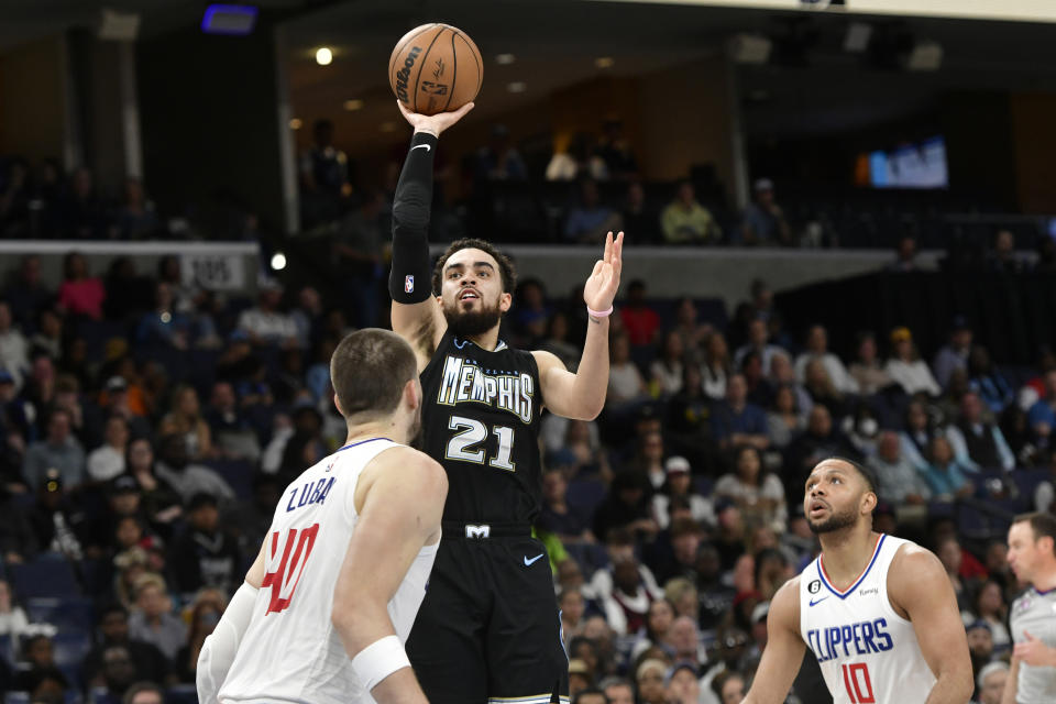 Memphis Grizzlies guard Tyus Jones (21) shoots against Los Angeles Clippers center Ivica Zubac (40) in the first half of an NBA basketball game Friday, March 31, 2023, in Memphis, Tenn. (AP Photo/Brandon Dill)