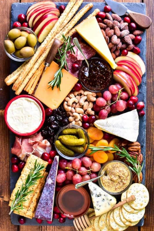 <p>Lemon Tree Dwelling</p><p>Perfect for holidays, ladies' nights or everyday entertaining, charcuterie boards are a fun, versatile, delicious addition to any gathering!</p><p><strong>Get the recipe: <a href="https://www.lemontreedwelling.com/how-to-make-the-perfect-cheese-board/" rel="nofollow noopener" target="_blank" data-ylk="slk:The Perfect Cheese Board;elm:context_link;itc:0;sec:content-canvas" class="link rapid-noclick-resp">The Perfect Cheese Board</a></strong></p>