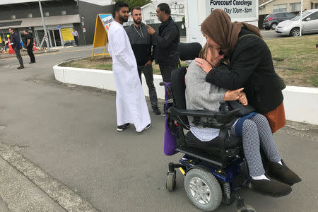 Women embrace in front of the Linwood mosque in Christchurch, New Zealand March 21, 2019. REUTERS/Jorge Silva