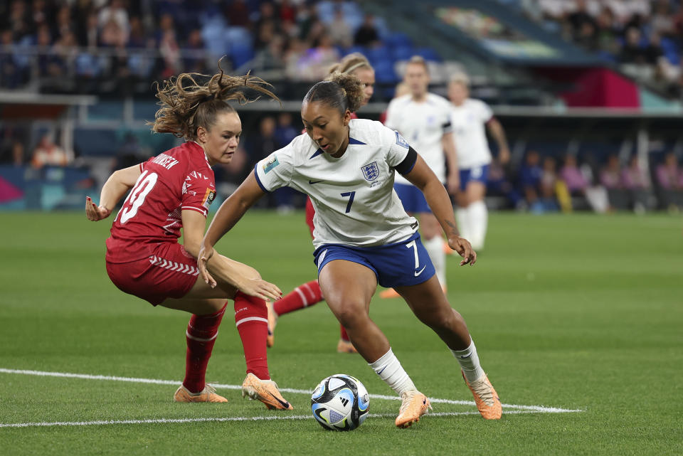 England's Lauren James competes for the ball with Denmark's Janni Thomsen during the Women's World Cup Group D soccer match between England and Denmark at Sydney Football Stadium in Sydney, Australia, Friday, July 28, 2023. (AP Photo/Sophie Ralph)