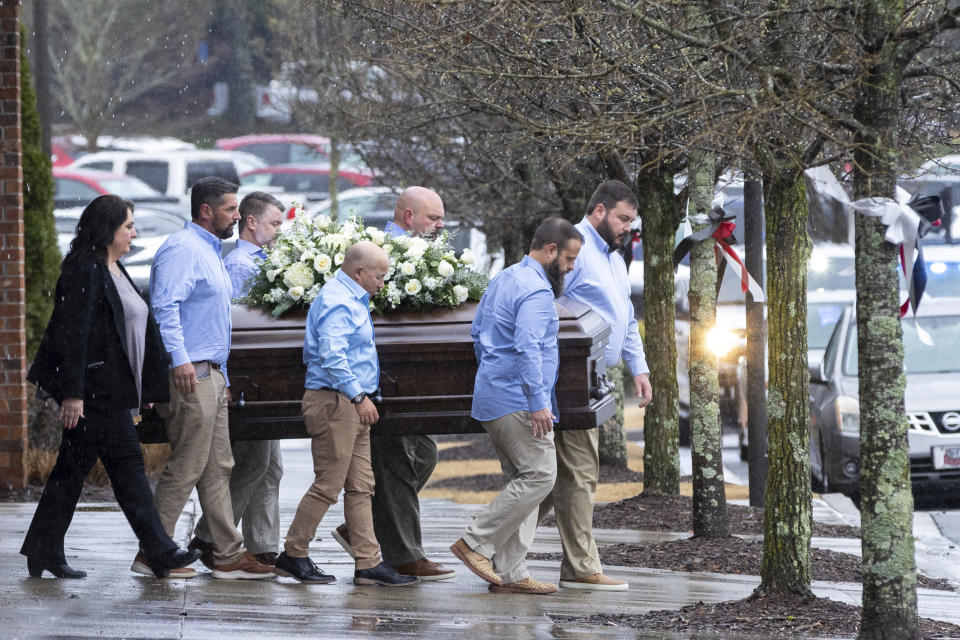 The casket of Laken Riley, the 22-year-old nursing student who was killed last week on the University of Georgia campus, is brought to a hearse following her funeral at Woodstock City Church in Woodstock, Ga., on Friday, March 1, 2024. (Arvin Temkar/Atlanta Journal-Constitution via AP)