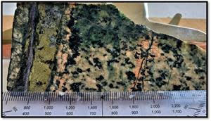 Quartz-pyrite-chalcopyrite-calcite vein within albite-quartz and fracture selvage K-spar altered Diorite within TH21-02 @ depth of 160.20m, from a 0.90 meter interval  grading 0.59%Cu, 0.12g/t Au and 1.99g/t Ag.