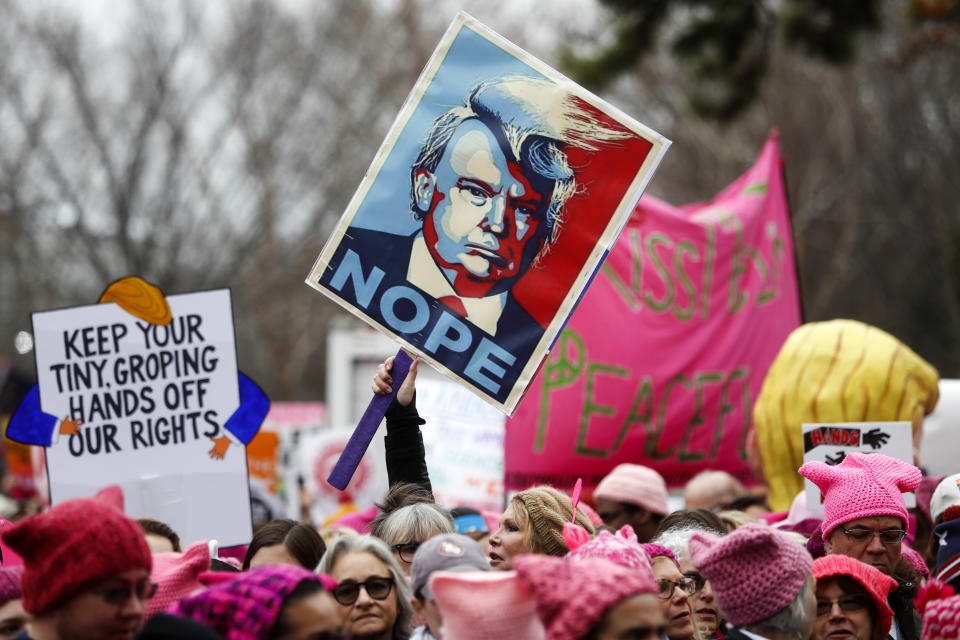 Protesters gather beside the stage at the Women’s March on Washington on Jan. 21, 2017. (AP Photo/John Minchillo)