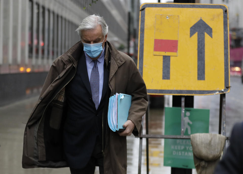 European Union chief Brexit negotiator Michel Barnier walks to the Conference Centre in London, Thursday, Dec. 3, 2020. With less than one month to go before the U.K. exits the EU's economic orbit, talks are continuing, and U.K. officials have said this is the last week to strike a deal. (AP Photo/Kirsty Wigglesworth)