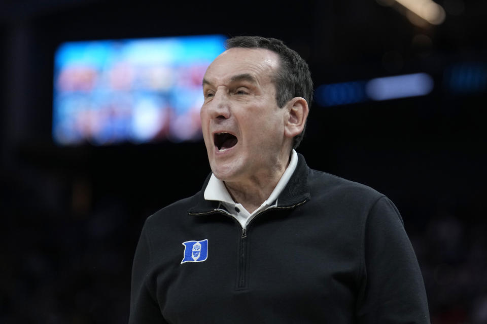 Duke head coach Mike Krzyzewski reacts toward players during the first half of his team's college basketball game against Arkansas in the Elite 8 round of the NCAA men's tournament in San Francisco, Saturday, March 26, 2022. (AP Photo/Tony Avelar)