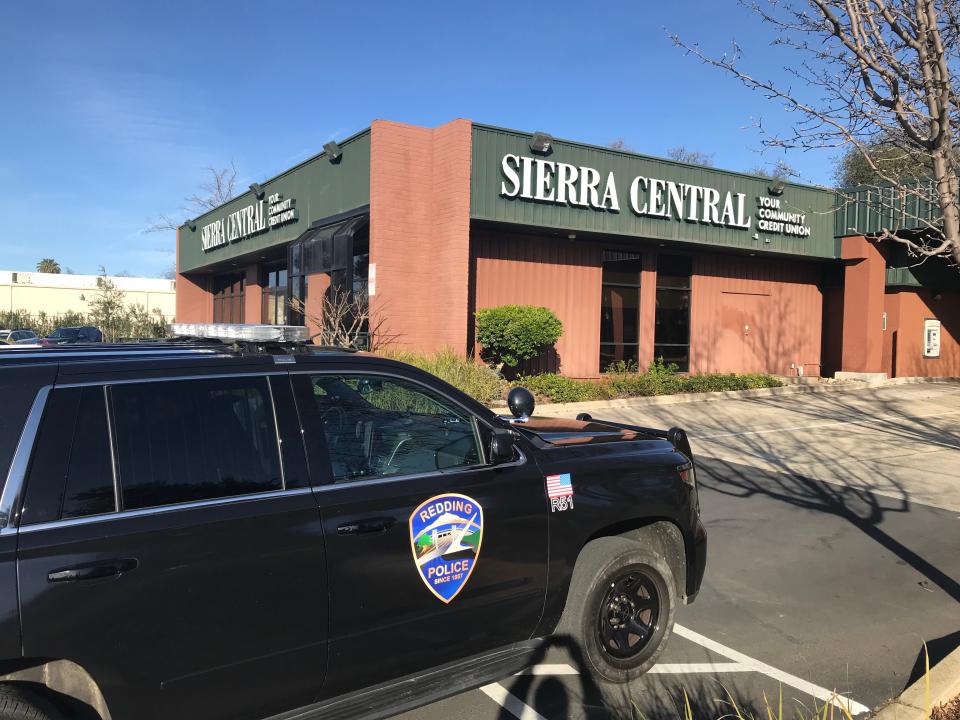 A Redding Police Department SUV is parked in front of Sierra Central Credit Union on Bechelli Lane. Police are investigating a robbery at the bank on Wednesday, Jan. 19, 2022.