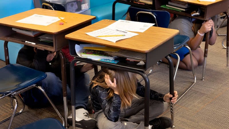Third graders participate in the statewide Utah Shakeout at Lincoln Elementary School in Salt Lake City on April 20, 2023. The Utah Division of Emergency Management is teaching Utahns how to navigate an emergency caused by an earthquake.