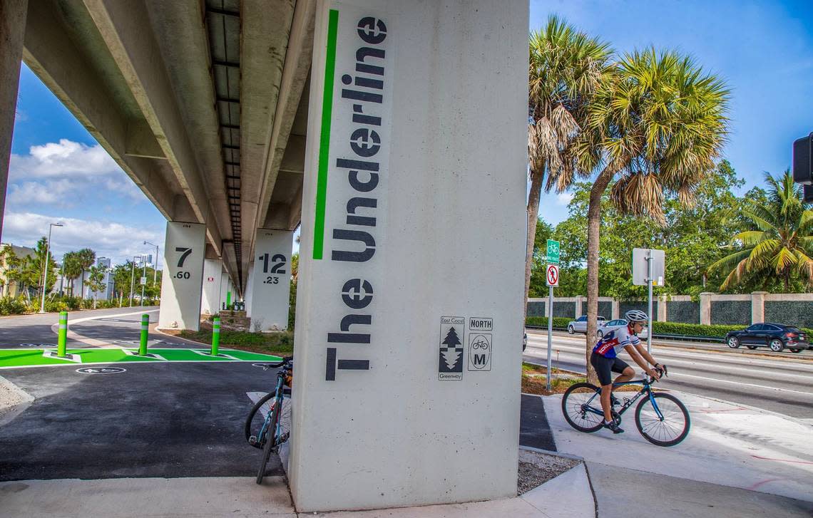 A cyclist rides past the Vizcaya Metroral Station along U.S. 1 on a new, two-mile section of The Underline urban trail and linear park that opens April 24.