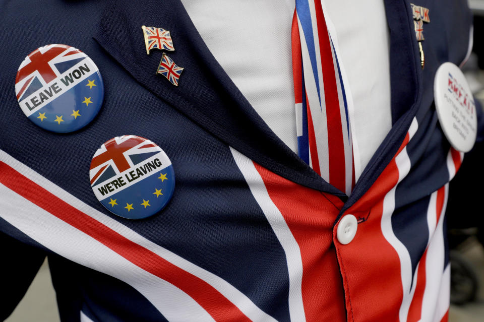 FILE - A pro-Brexit supporter wears badges as he demonstrates outside Parliament in London, Oct. 28, 2019. After an acrimonious divorce and years of bickering, Britain’s government looks like it wants to make up with the European Union. European politicians and diplomats have noticed a marked softening of tone since Prime Minister Liz Truss took over from Boris Johnson as U.K. leader a month ago. (AP Photo/Kirsty Wigglesworth, file)