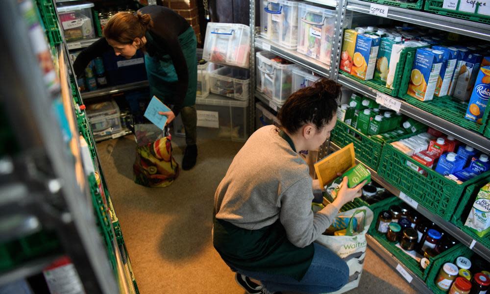 Volunteers at Wandsworth food bank prepare food parcels for guests from their stores of donated food, toiletries and other items