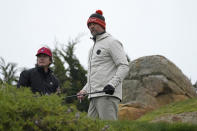 Josh Duhamel, right, prepares to hit from the 11th tee of the Monterey Peninsula Country Club Shore Course as Jason Bateman looks on during the second round of the AT&T Pebble Beach Pro-Am golf tournament in Pebble Beach, Calif., Friday, Feb. 3, 2023. (AP Photo/Eric Risberg)