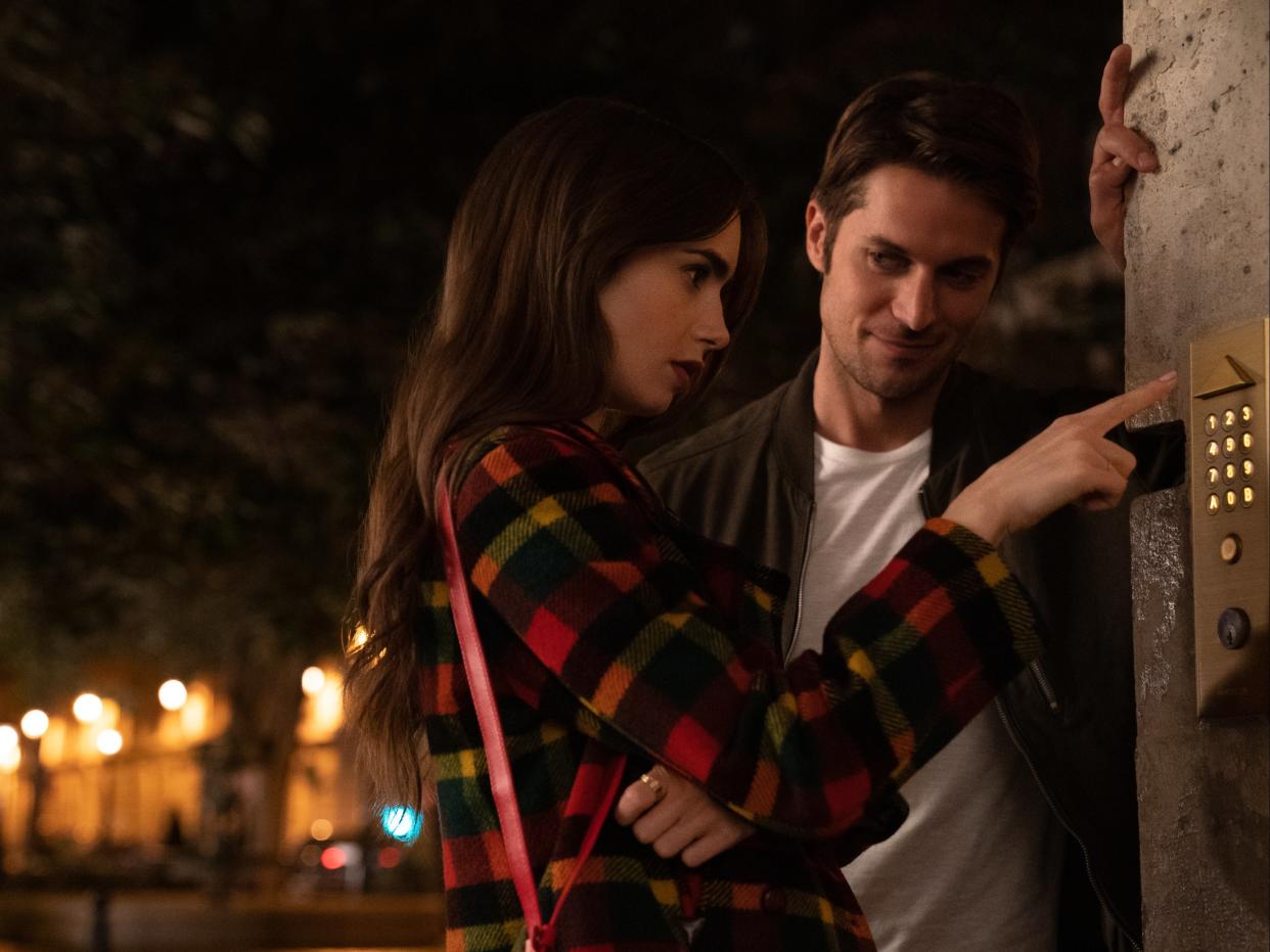 Lily Collins and Lucas Bravo in Emily in Paris (STEPHANIE BRANCHU/NETFLIX)