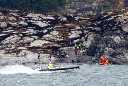 Police and rescue workers are cleaning up in the area where a helicopter crashed Friday April 29. Torstein Boe/NTB Scanpix/via Reuters