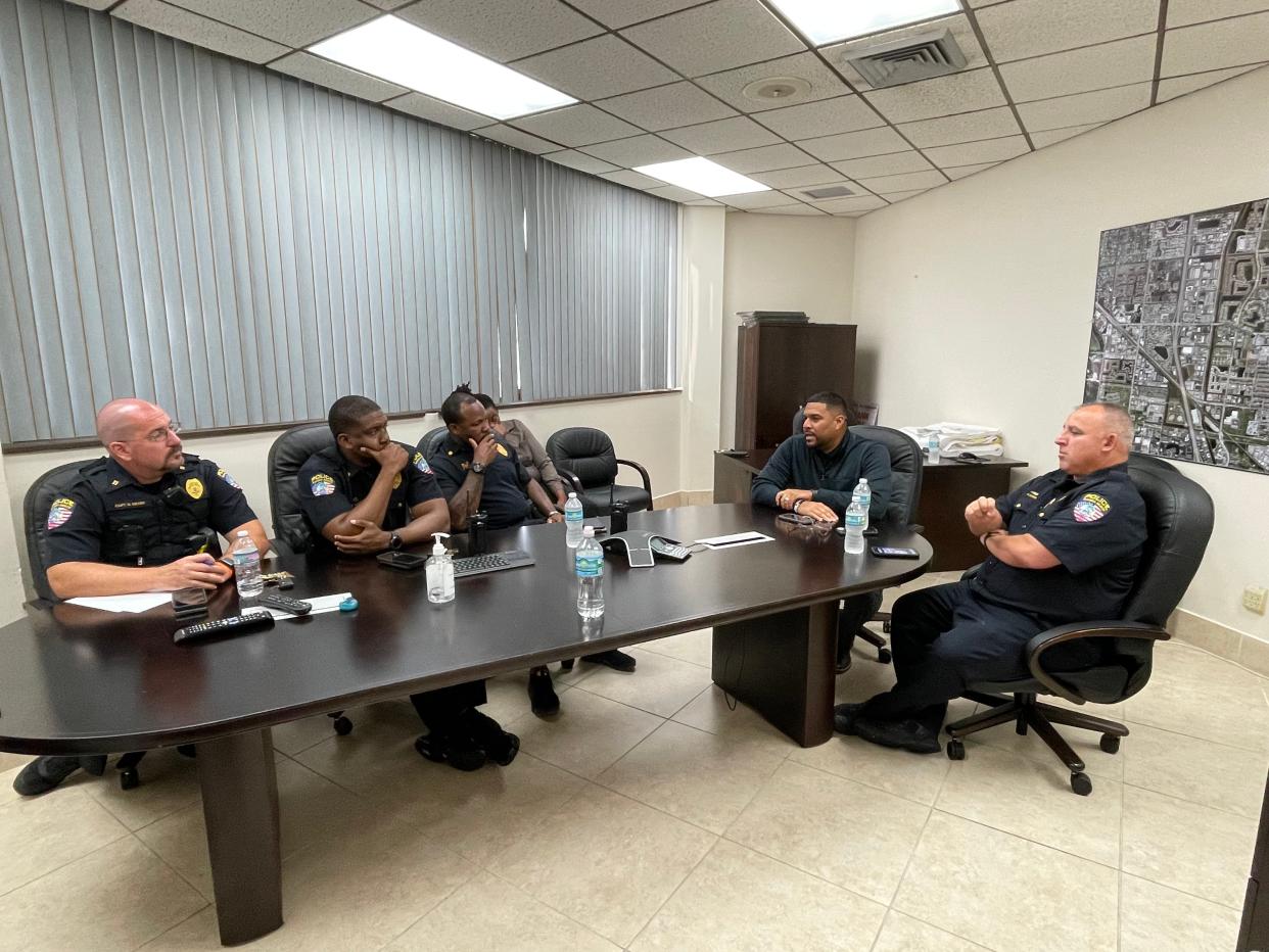 City Manager Jonathan Lewis (second from right) and Interim Police Chief Joshua Lewis address the command staff.