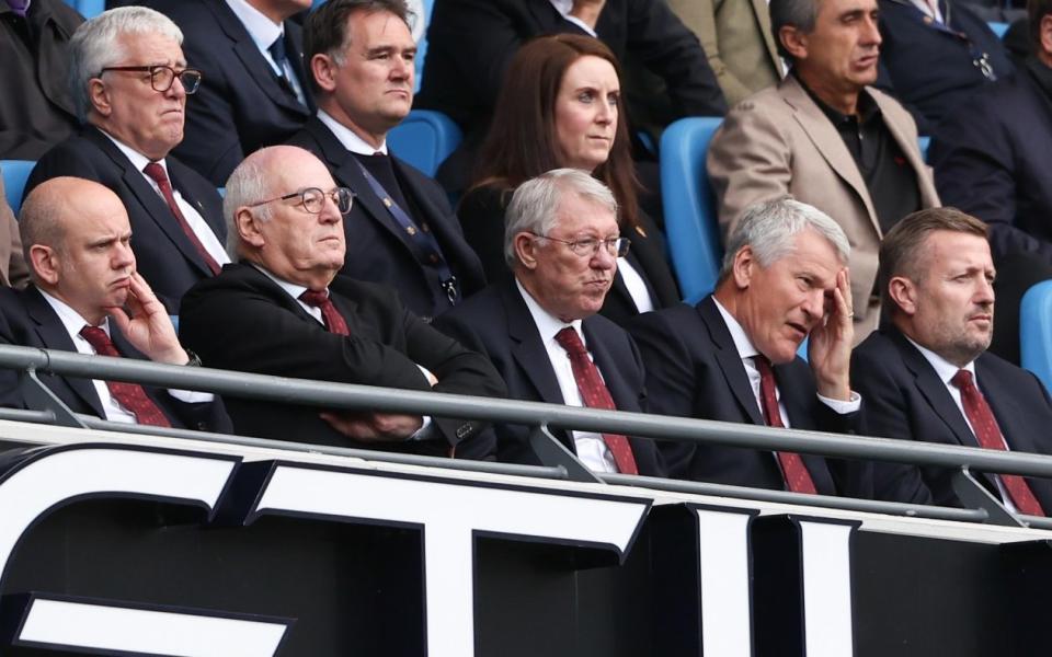Sir Alex Ferguson looks dejected at Manchester United's capitulation at Manchester City - Getty Images