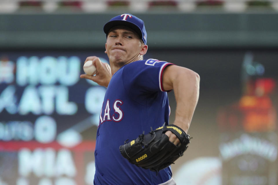 Texas Rangers pitcher Glenn Otto throws against the Minnesota Twins in the first inning of a baseball game, Saturday, Aug. 20, 2022, in Minneapolis. (AP Photo/Jim Mone)