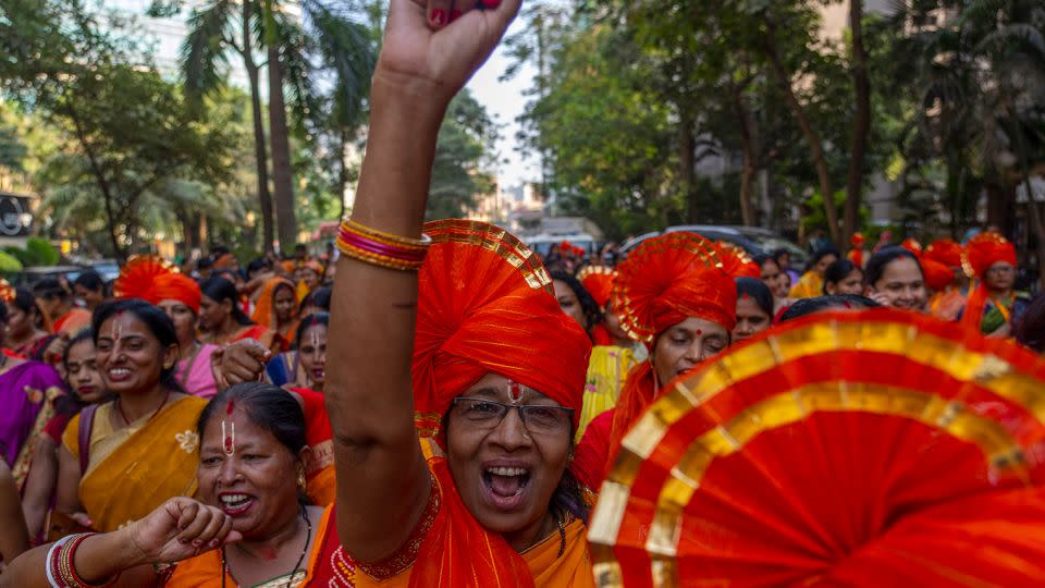 Hindu women chant holy slogans to celebrate the upcoming opening of a grand temple for the Lord Ram, in India's northern Ayodhya city during a procession in Mumbai, India, on January 21, 2024. - Rafiq Maqbool/AP