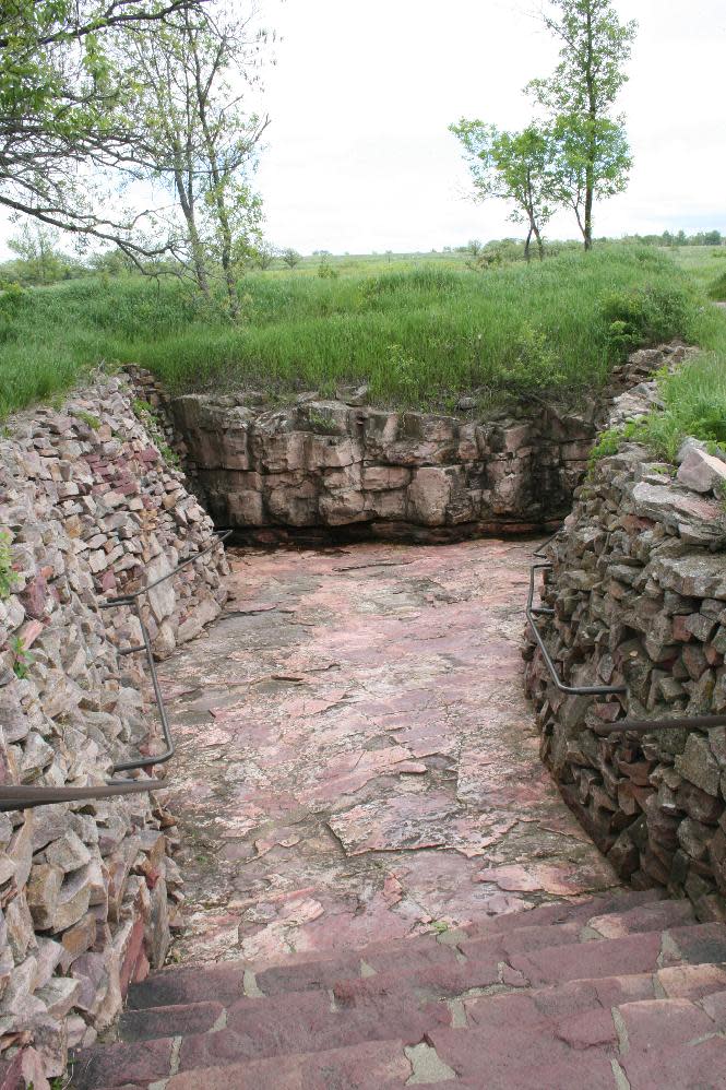 This June 5, 2013 photo shows a quarry at Pipestone National Monument in Minnesota. More than 50 Native Americans travel to Pipestone to quarry catlinite that will then be carved into pipes used in traditional ceremonies. The site also offers a museum and trail for visitors. (AP Photos/Kristi Eaton)