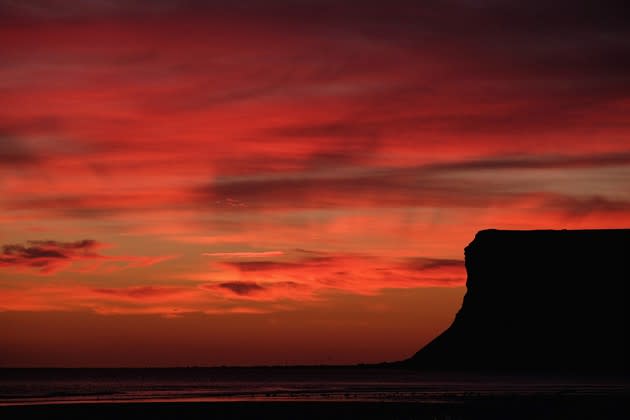 The sun rises over the beach in Saltburn-by-the-Sea, England, on September 26, 2016. <a href="http://www.theatlantic.com/photo/2016/09/fall-is-in-the-air/501641/?utm_source=yahoo" rel="nofollow noopener" target="_blank" data-ylk="slk:See more photos of early fall here.;elm:context_link;itc:0;sec:content-canvas" class="link ">See more photos of early fall here.</a> (Ian Forsyth / Getty)