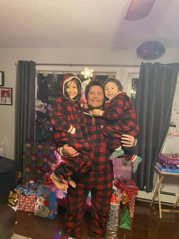 Kelly McLeod, in a photo posted to his official campaign Facebook page, poses with his children. McLeod has been elected the new president of the Nihtat Gwich'in Council, according to preliminary results. (Kelly McLeod for Nihtat President 2021/Facebook - image credit)