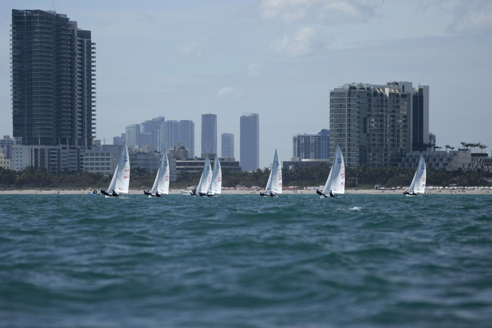 Lara Dallman-Weiss and Stu McNay (1842) compete in the mixed-gender 470 category at U.S. Sailing Olympic Trials, off the coast of Miami Beach, Fla., Friday, Jan. 12, 2024. McNay is returning for his fifth Olympics and teaming up with Dallman-Weiss, who competed in the women's 470 in the Tokyo Games, in the new mixed-gender category. (AP Photo/Rebecca Blackwell)