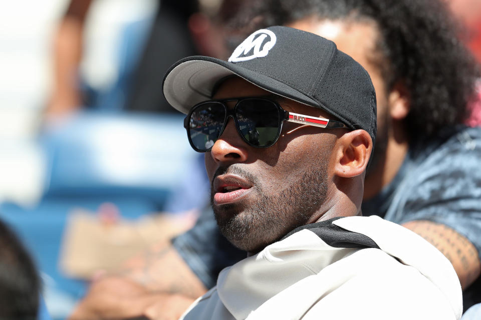 Kobe Bryant said hello to Colin Kaepernick as the two watched Naomi Osaka play at the US Open. (Photo by Al Bello/Getty Images)