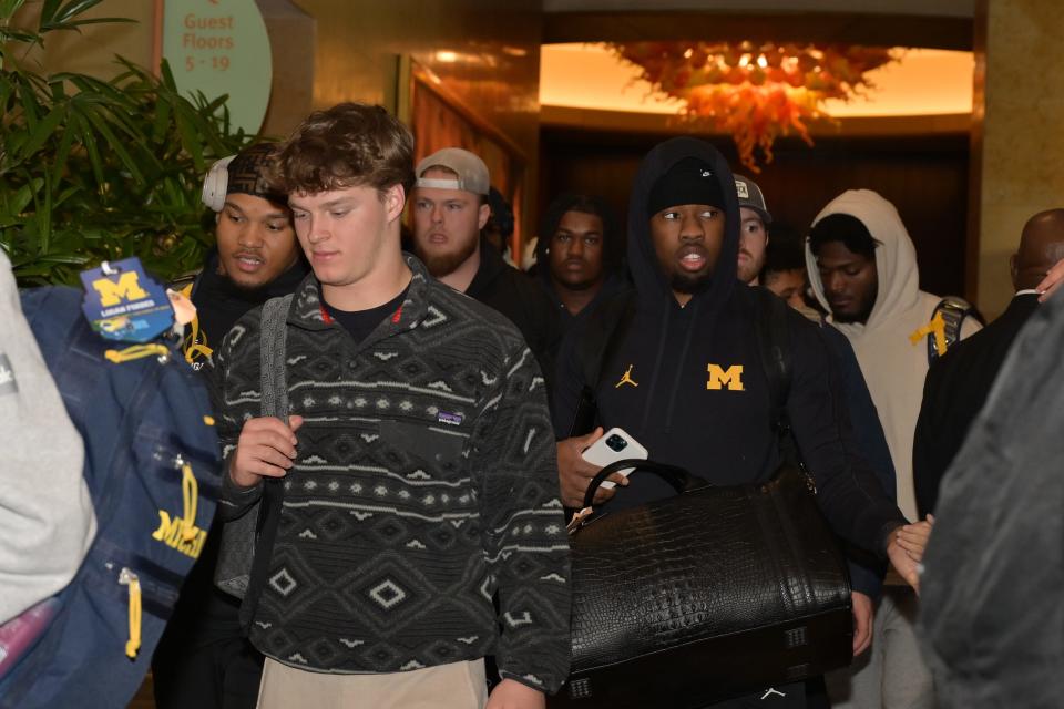 Michigan Wolverines players arriving at Hilton Americas in Houston on Friday, Jan. 5, 2024.