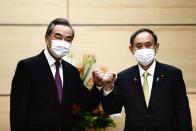 Japan's PM Suga meets China's State Councillor Yi in Tokyo