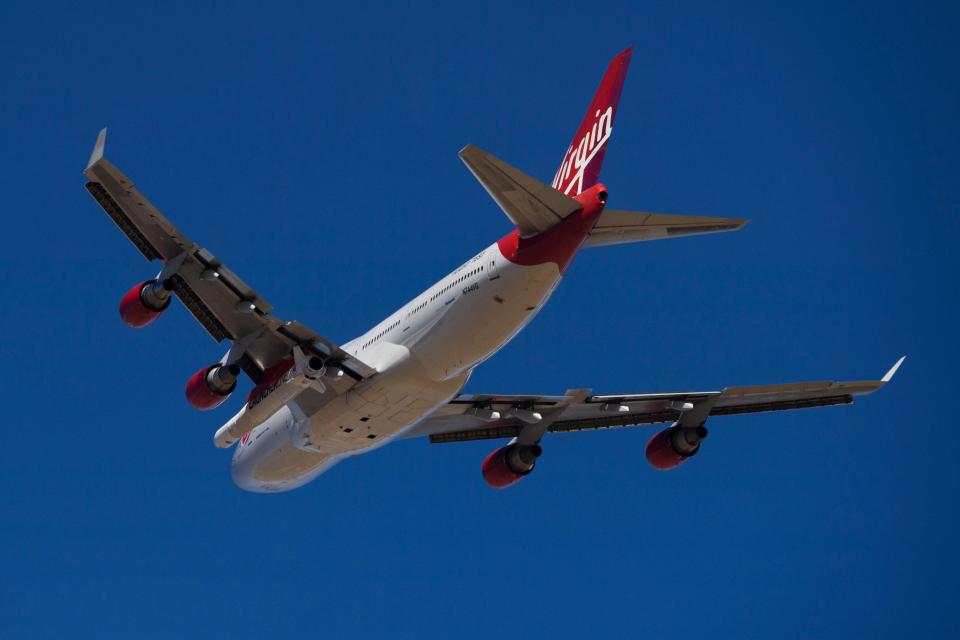 The Virgin Orbit "Cosmic Girl" - a modified Boeing Co. 747-400 carrying a LauncherOne rocket under it's wing - takes off for the Launch Demo 2 mission from Mojave Air and Space Port on January 17, 2021 in Mojave, California.