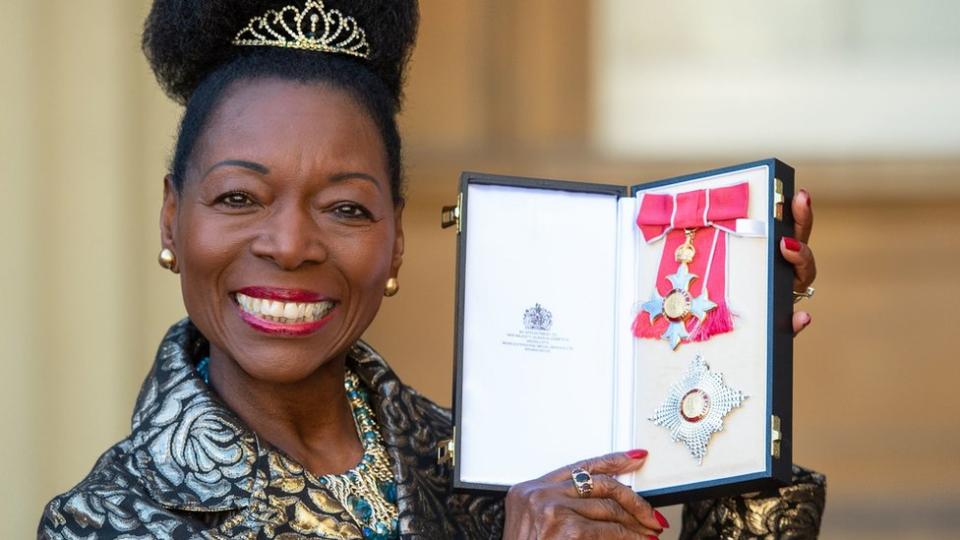 Floella Benjamin receiving her Damehood at Buckingham Palace